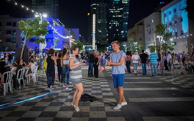 Israelis socialize during Tel Aviv's annual White Night celebration, June 30, 2016. (Miriam Alster/Flash90) Israelis socialize during Tel Aviv's annual White Night celebration, June 30, 2016. (Miriam Alster/Flash90)