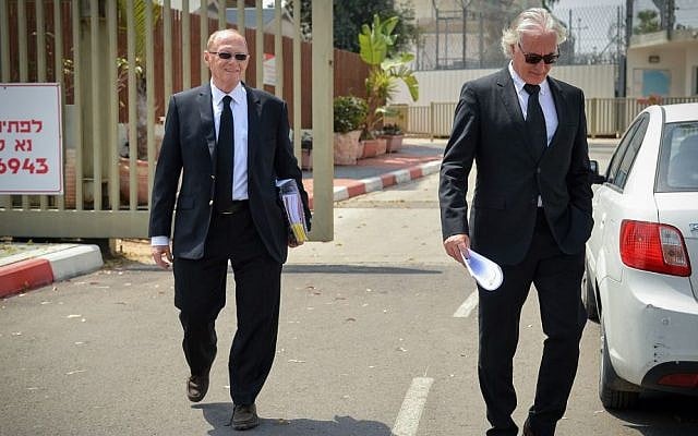 Zion Amir and Yehoshua Reznik, attorneys of former Israeli president Moshe Katsav, leave a hearing at the Israel Prison Service, April 06, 2016. (Flash90)