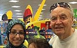 A man poses for a picture with Leena Al-Arian, who is Muslim, after apologizing to her for racism in the US (Facebook)