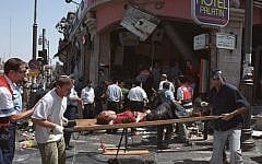 The aftermath of a suicide bombing at a Sbarro restaurant in Jerusalem in August 9, 2001, that killed 15 and wounded over 100 more. (Flash90)