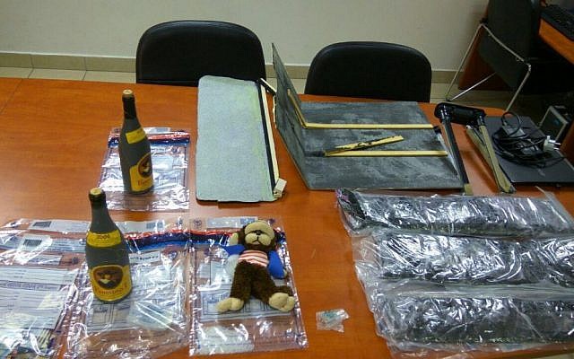 Bottles of wine filled with MDMA and a suitcase saturated with the illegal drug, caught by police at Ben Gurion Airport on July 31, 2016. (Israel Police) Bottles of wine filled with MDMA and a suitcase saturated with the illegal drug, caught by police at Ben Gurion Airport on July 31, 2016. (Israel Police)