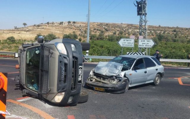 An IDF jeep and Palestinian vehicle after a possible car-ramming attack outside the Neve Daniel settlement in the West Bank on July 6, 2016. (Israel Police) An IDF jeep and Palestinian vehicle after a possible car-ramming attack outside the Neve Daniel settlement in the West Bank on July 6, 2016. (Israel Police)