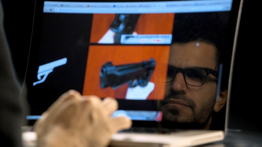 Yuval Orr surfs the dark net in a scene from "Down the deep, dark web" (Courtesy)