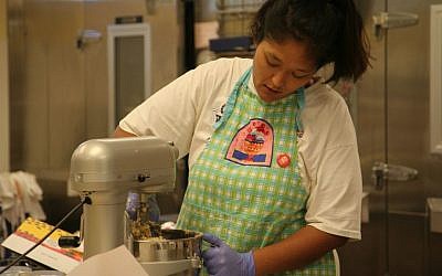 Kimberly Ferry, who had endured years of homelessness and mental health struggles, working at the Altamont Bakery in Tulsa. (Courtesy of Congregation B'nai Emunah/via JTA)