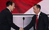 Rabbi Ari Wolf, left, shaking hands with Reince Priebus, chairman of the Republican National Committee, at the start of the first day of the Republican National Convention at the Quicken Loans Arena in Cleveland, July 18, 2016. (Alex Wong/Getty Images via JTA)
