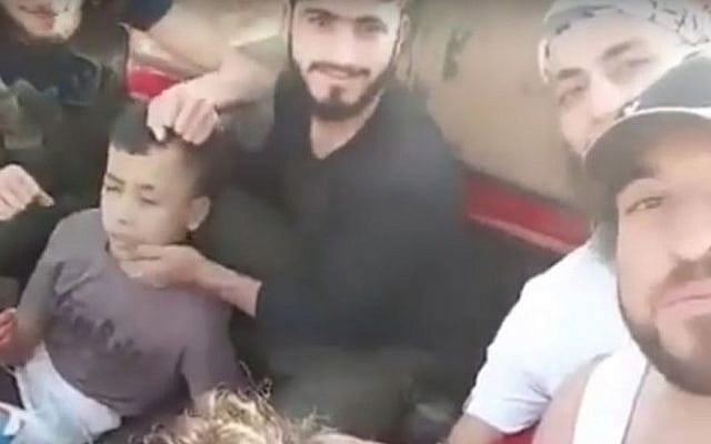 A boy captured by Syrian rebels before being beheaded, in a video released June 19, 2016. (screen capture: YouTube) A boy captured by Syrian rebels before being beheaded, in a video released June 19, 2016. (screen capture: YouTube)