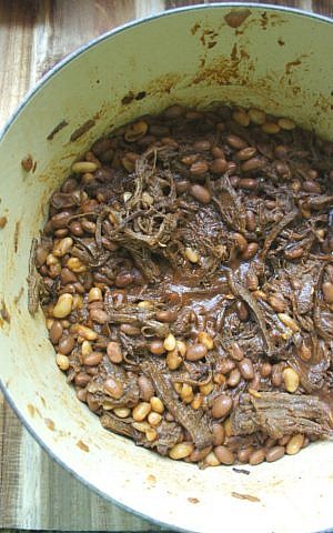 Barbecue brisket and beans combines the flavors of sweet pulled brisket and a can of baked beans. (Shannon Sarna/via JTA) Barbecue brisket and beans combines the flavors of sweet pulled brisket and a can of baked beans. (Shannon Sarna/via JTA)