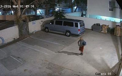 A man caught on security cameras as he  burglarized the Chabad Center at the University of Southern California in july 2016. (YouTube/collivedotcom)