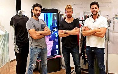 Yossi Shriki, Asaf Shapira and Roy Dror of CheckOut Apps in their Tel Aviv office. (Courtesy)