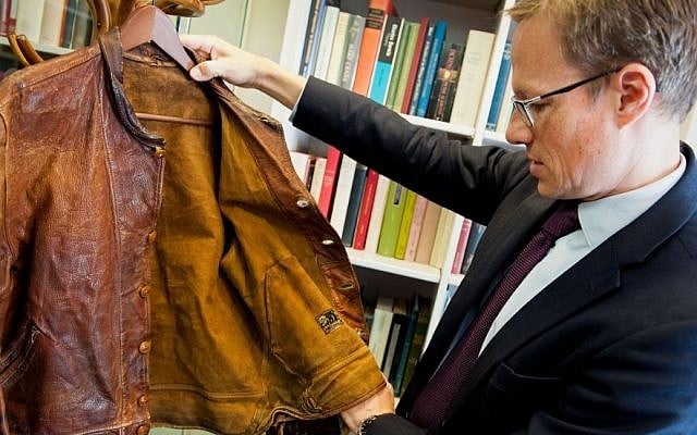 Thomas Venning examines Albert Einstein's leather jacket ahead of an auction in which the clothing item will be sold. (Courtesy Christie's) Thomas Venning examines Albert Einstein's leather jacket ahead of an auction in which the clothing item will be sold. (Courtesy Christie's)