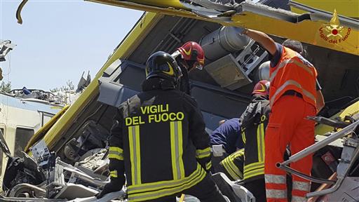 Italian firefighters inspect the wreckage of two commuter trains after their head-on collision in the southern region of Puglia, killing at least 20 people, on July 12, 2016. (Italian Firefighter Press Office via AP) Italian firefighters inspect the wreckage of two commuter trains after their head-on collision in the southern region of Puglia, killing at least 20 people, on July 12, 2016. (Italian Firefighter Press Office via AP)