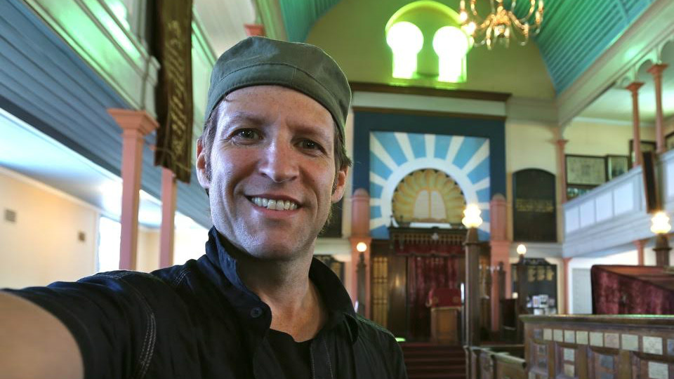 Photographer Jono David in the Jewish Pioneers' Memorial Museum (former Raleigh Street Synagogue) in Port Elizabeth, South Africa. (Courtesy Jono David)