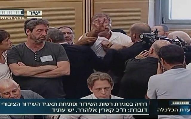 IBA employee Rafi Issachar interrupts a Knesset hearing about the deferral of the founding of a new public broadcasting authority. (screen capture: Knesset Channel) IBA employee Rafi Issachar interrupts a Knesset hearing about the deferral of the founding of a new public broadcasting authority. (screen capture: Knesset Channel)