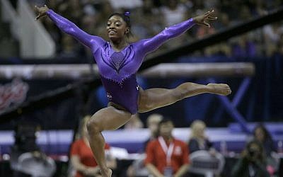 Simone Biles competes on the floor exercise during the women's U.S. Olympic gymnastics trials in San Jose, California, Friday, July 8, 2016. (AP Photo/Ben Margot)