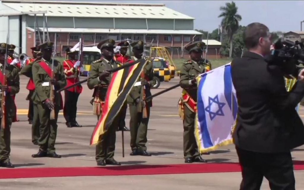 A Ugandan honor guard greets Prime Minister Benjamin Netanyahu's entourage upon landing in Entebbe on Monday, July 4, 2016 (screen capture: YouTube)