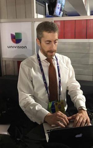 Joel Pollak of Breitbart News working at the Republican National Convention in Cleveland, July 2016. (Ron Kampeas)