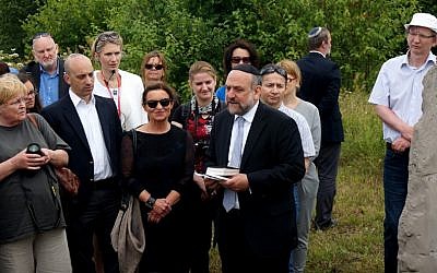Michael Schudrich, Poland’s chief rabbi, reciting a prayer for the victims of the Jedwabne massacre at the town’s Jewish cemetery, July 10, 2016. Second from left is Jonathan Greenblatt, the Anti-Defamation League’s national director. (Cnaan Liphshiz)