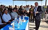 Defense Minister Avigdor Liberman at the Hizme Checkpoint, July 17, 2016, talking to officials about improving conditions at West Bank Crossings into Jerusalem. (Courtesy: Facebook)