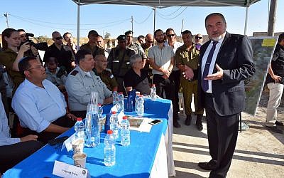 Defense Minister Avigdor Liberman at the Hizme Checkpoint, July 17, 2016, talking to officials about improving conditions at West Bank Crossings into Jerusalem. (Courtesy: Facebook)