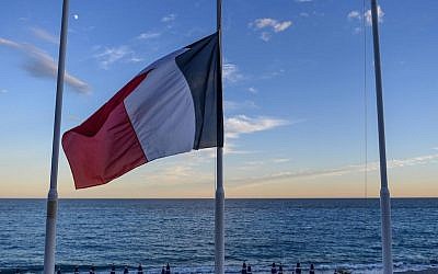 A French flag flying at half-mast at an empty beach on the Promenade des Anglais in Nice a day after a terrorist attack in the French city killed 84, July 15, 2016. (David Ramos/Getty Images)