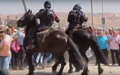Palestinians and Israeli security forces clash at the Qalandiya checkpoint between Jerusalem and Ramallah on July 1, 2016 (screen capture: YouTube)