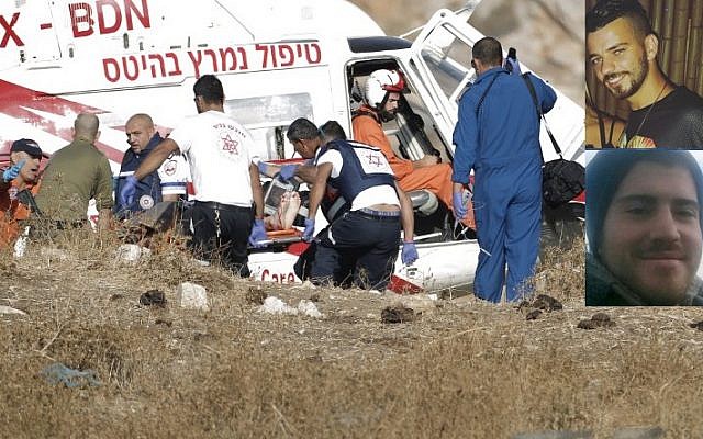 Paramedics and rescue personnel attend the scene after a grenade accidentally discharges at an IDF base on the Golan Heights, killing Staff Sgt. Hussam Tafesh (inset, top) and Sgt. Shlomo Rindenow (inset, bottom) on July 17, 2016 (JALAA MAREY/AFP) Paramedics and rescue personnel attend the scene after a grenade accidentally discharges at an IDF base on the Golan Heights, killing Staff Sgt. Hussam Tafesh (inset, top) and Sgt. Shlomo Rindenow (inset, bottom) on July 17, 2016 (JALAA MAREY/AFP)