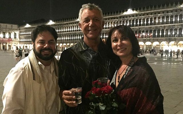 Newlyweds David Mednick and Lana Atlasov drink a 'l'chaim' with officiant Todd Shotz (left) after their spontaneous Jewish wedding ceremony at Piazza San Marco, Venice, Italy on June 26, 2016. (Courtesy)
