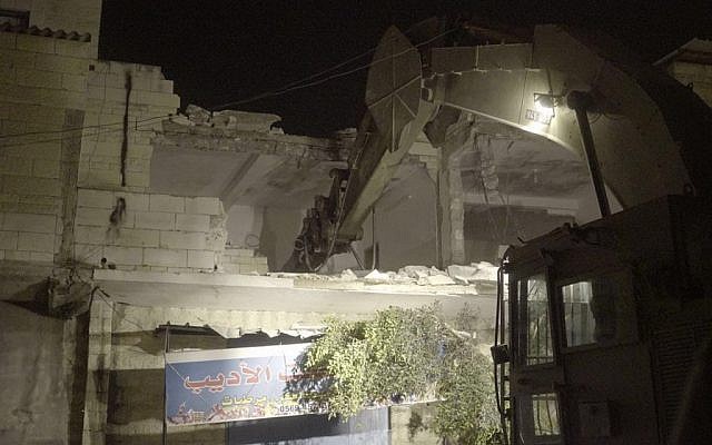 Security forces destroying the home of Palestinian Balal Abu Zeid who was convicted of assisting in a terror attacked during which a border guard was killed. Abu Zeid's home in Qabatiya was demolished July 18, 2016. (IDF spokesperson)