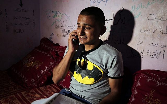 Palestinian singer Adel Meshoukhi speaking on the phone at his home in Rafah in the southern Gaza Strip, July 29, 2016. (AFP/SAID KHATIB) Palestinian singer Adel Meshoukhi speaking on the phone at his home in Rafah in the southern Gaza Strip, July 29, 2016. (AFP/SAID KHATIB)