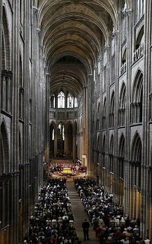 FRANCE-ATTACK-RELIGION People gather at the Rouen cathedral in northern France on August 2, 2016 for the funeral of Father Jacques Hamel, the 85-year-old priest who was murdered by two jihadists on July 26, 2016. (AFP PHOTO / POOL / CHARLY TRIBALLEAU)