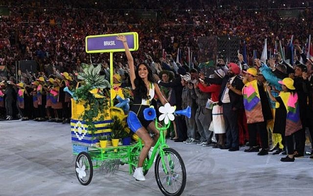 A woman on a bicycle leads the Brazil delegation during the opening ceremony of the Rio 2016 Olympic Games at the Maracana stadium in Rio de Janeiro on August 5, 2016. (AFP PHOTO / Leon NEAL) A woman on a bicycle leads the Brazil delegation during the opening ceremony of the Rio 2016 Olympic Games at the Maracana stadium in Rio de Janeiro on August 5, 2016. (AFP PHOTO / Leon NEAL)