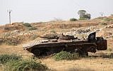 A tank bearing an Islamist flag is seen in a field as a Syrian coalition of jihadists and Islamist rebels seized key positions south of Aleppo in a major offensive to break the government siege of the city, on August 6, 2016, the Syrian Observatory for Human Rights said. (AFP/Omar haj Kadour)