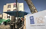 Palestinian construction laborers work on a water well at a Saudi Arabia-funded housing project executed by the United Nations Development Program (UNDP), in Rafah in the southern Gaza Strip, August 9, 2016. (AFP/Said Khatib)