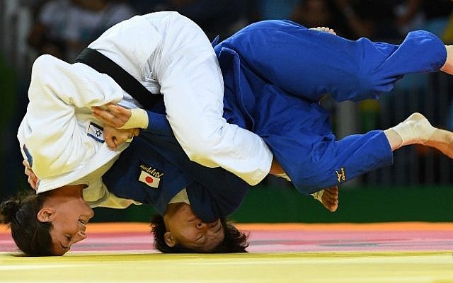 Israel's Yarden Gerbi (white) competes with Japan's Miku Tashiro during their women's -63kg judo contest bronze medal A match of the Rio 2016 Olympic Games in Rio de Janeiro on August 9, 2016. (AFP PHOTO / Toshifumi KITAMURA) Israel's Yarden Gerbi (white) competes with Japan's Miku Tashiro during their women's -63kg judo contest bronze medal A match of the Rio 2016 Olympic Games in Rio de Janeiro on August 9, 2016. (AFP PHOTO / Toshifumi KITAMURA)