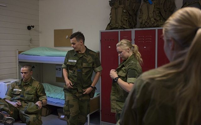 Female and male army recruits stand in their room in the barracks at the armored battalion in Setermoen, northern Norway on August 11, 2016.
Norway has become the first NATO member to have compulsory conscription for women as well as men in the army. Recently, the first batch of army recruits joined the ranks in The Armored Battalion in the Norwegian Army located in Setermoen in northern Norway.
/ AFP PHOTO / KYRRE LIEN / TO GO WITH AFP STORY BY PIERRE-HENRY DESHAYES Female and male army recruits stand in their room in the barracks at the armored battalion in Setermoen, northern Norway on August 11, 2016.
Norway has become the first NATO member to have compulsory conscription for women as well as men in the army. Recently, the first batch of army recruits joined the ranks in The Armored Battalion in the Norwegian Army located in Setermoen in northern Norway.
/ AFP PHOTO / KYRRE LIEN / TO GO WITH AFP STORY BY PIERRE-HENRY DESHAYES