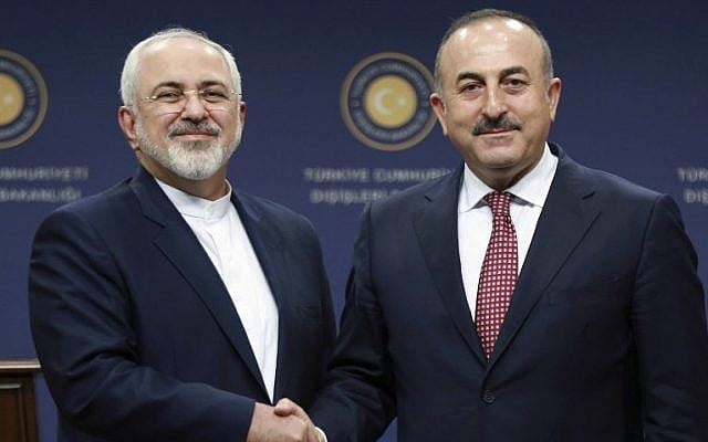 Turkish Foreign Minister Mevlut Cavusoglu, right, and Iran's Foreign Minister Mohammad Javad Zarif shake hands following a joint press conference at the Foreign Ministry in Ankara on August 12, 2016. (AFP/Adem Altan) Turkish Foreign Minister Mevlut Cavusoglu, right, and Iran's Foreign Minister Mohammad Javad Zarif shake hands following a joint press conference at the Foreign Ministry in Ankara on August 12, 2016. (AFP/Adem Altan)