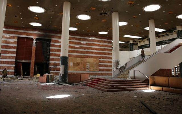 Libyan pro-government forces inspect the Ouagadougou conference center, where Islamic State (IS) had set up base, in Sirte on August 12, 2016, after pro-government forces seized it from the Islamic State. (AFP PHOTO / STRINGER)