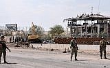 Illustrative: Turkish soldiers stand on guard at the site of a car bomb explosion blamed on Kurdistan Workers' Party (PKK) rebels on August 15, 2016, in Diyardakir. (AFP PHOTO / ILYAS AKENGIN)
