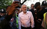Britain's opposition Labour Party Leader Jeremy Corbyn (C) leaves after delivering a speech at a Black, Asian and minority ethnic (BAME) rally in north London on August 15, 2016. (AFP PHOTO / DANIEL LEAL-OLIVAS)