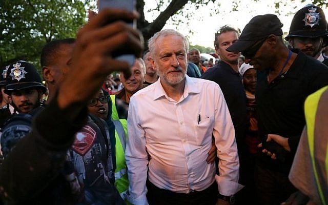 Britain's opposition Labour Party Leader Jeremy Corbyn (C) leaves after delivering a speech at a Black, Asian and minority ethnic (BAME) rally in north London on August 15, 2016. (AFP PHOTO / DANIEL LEAL-OLIVAS) Britain's opposition Labour Party Leader Jeremy Corbyn (C) leaves after delivering a speech at a Black, Asian and minority ethnic (BAME) rally in north London on August 15, 2016. (AFP PHOTO / DANIEL LEAL-OLIVAS)