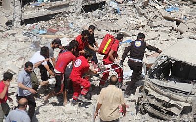 Syrian rescue workers carry a young victim on a stretcher following a reported air srike on the rebel-held northwestern city of Idlib on 17 August, 2016. (AFP PHOTO/Omar haj kadour) Syrian rescue workers carry a young victim on a stretcher following a reported air srike on the rebel-held northwestern city of Idlib on 17 August, 2016. (AFP PHOTO/Omar haj kadour)