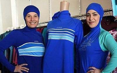 Muslim models display burkini swimsuits at a shop in western Sydney on August 19, 2016. (AFP PHOTO / SAEED KHAN)
