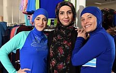 Muslim models display burkini swimsuits at a shop in western Sydney on August 19, 2016. (AFP/SAEED KHAN)