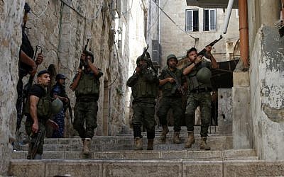 Illustrative: Palestinian security forces patrol in the West Bank city of Nablus on August 19, 2016, amid clashes. (AFP Photo/Jaafar Ashtiyeh)