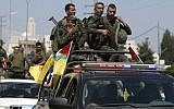 Members of the Palestinian security forces patrol in the West Bank city of Nablus on August 19, 2016, during ongoing clashes between the security forces and Palestinian gunmen. (AFP PHOTO / JAAFAR ASHTIYEH)