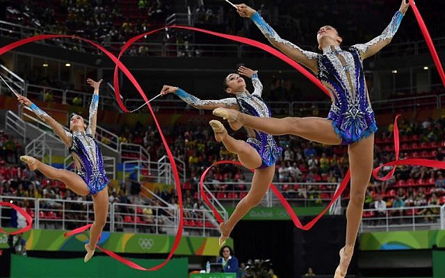 Israel competes in the group all-around qualifying event of the Rhythmic Gymnastics at the Olympic Arena during the Rio 2016 Olympics in Rio de Janeiro, Brazil, on August 20, 2016. (AFP/Ben Stansall) Israel competes in the group all-around qualifying event of the Rhythmic Gymnastics at the Olympic Arena during the Rio 2016 Olympics in Rio de Janeiro, Brazil, on August 20, 2016. (AFP/Ben Stansall)