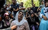 Women cry during a funeral  for a victim of last night's attack on a wedding party that left 50 dead in Gaziantep in southeastern Turkey near the Syrian border, on August 21, 2016. (AFP Photo/Ilyas Akengin)