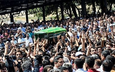 Mourners carry a coffin during a funeral procession in Gaziantep, Turkey on August 21, 2016, a day after a bombing at a wedding party in the southeastern city killed over 50 people. (AFP/ILYAS AKENGIN) Mourners carry a coffin during a funeral procession in Gaziantep, Turkey on August 21, 2016, a day after a bombing at a wedding party in the southeastern city killed over 50 people. (AFP/ILYAS AKENGIN)