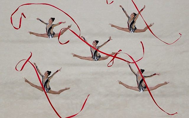 Israel's team competes in the group all-around final event of the Rhythmic Gymnastics at the Olympic Arena during the Rio 2016 Olympic Games in Rio de Janeiro on August 21, 2016. (AFP PHOTO / Thomas COEX) Israel's team competes in the group all-around final event of the Rhythmic Gymnastics at the Olympic Arena during the Rio 2016 Olympic Games in Rio de Janeiro on August 21, 2016. (AFP PHOTO / Thomas COEX)