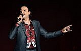 This file photo taken on August 08, 2014 shows Tunisian singer Saber Rebai performing during the 50th session of the International Carthage Festival at the Roman theater of Carthage near Tunis. (AFP PHOTO / FETHI BELAID)